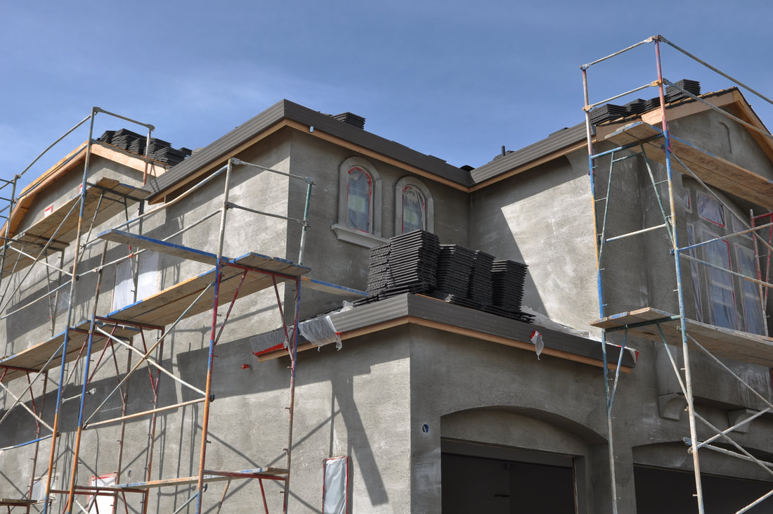 House getting complete exterior stucco refinishing in Melbourne, FL